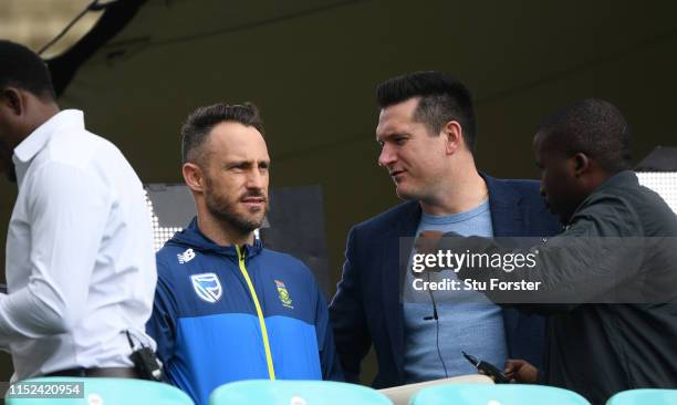 South Africa captain Faf du Plessis talks with ex captain Graeme Smith ahead of their opening ICC CRricket World Cup match against England at The...