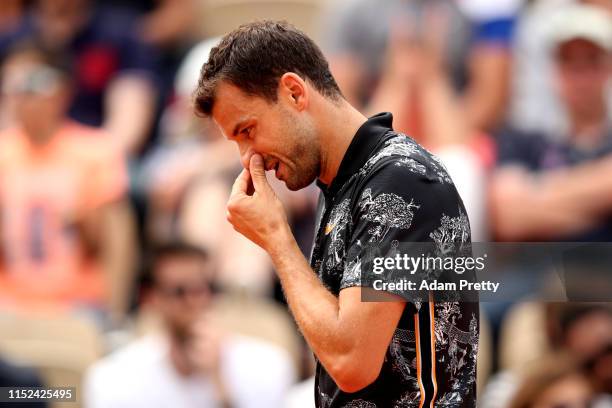 Grigor Dimitrov of Bulgaria reacts during his mens singles second round match against Marin Cilic of Croatia during Day four of the 2019 French Open...