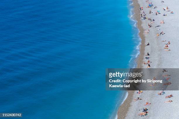 summer activity on the beach - aerial beach view sunbathers stock pictures, royalty-free photos & images