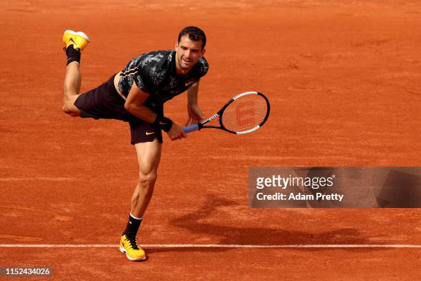 Grigor Dimitrov of Bulgaria serves during his mens singles second round match against Marin Cilic of Croatia during Day four of the 2019 French Open...