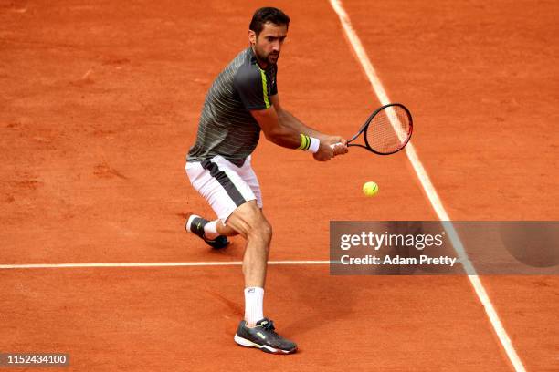 Marin Cilic of Croatia plays a backhand during his mens singles second round match against Grigor Dimitrov of Bulgaria during Day four of the 2019...