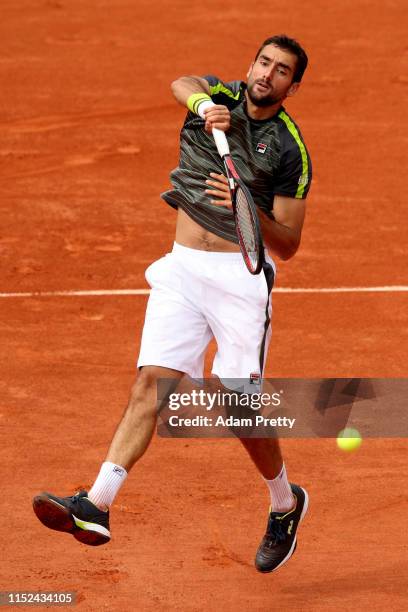 Marin Cilic of Croatia volleys during his mens singles second round match against Grigor Dimitrov of Bulgaria during Day four of the 2019 French Open...