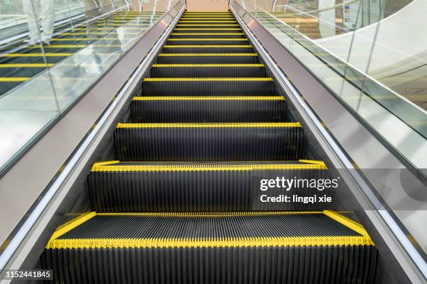 escalator in the mall - shopping centre escalator stock pictures, royalty-free photos & images
