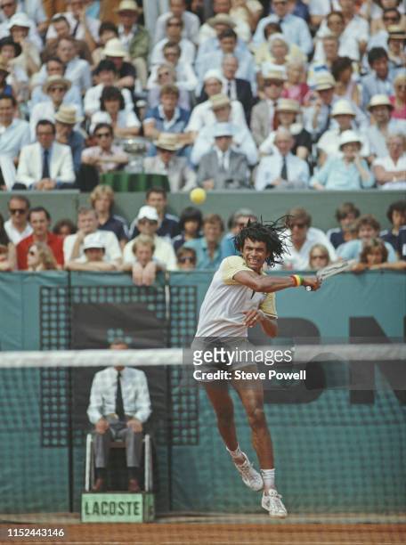 Yannick Noah of France powers a forehand return against Mats Wilander from Sweden during their Men's Singles final match of the French Open Tennis...