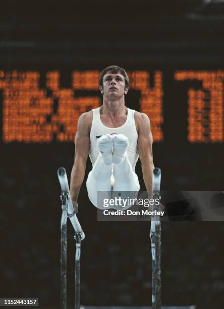 Plamen Petkov of Bulgaria performs during the Men's parallel bars competition on 25th July 1980 during the XXII Olympic Summer Games at the Palace of...