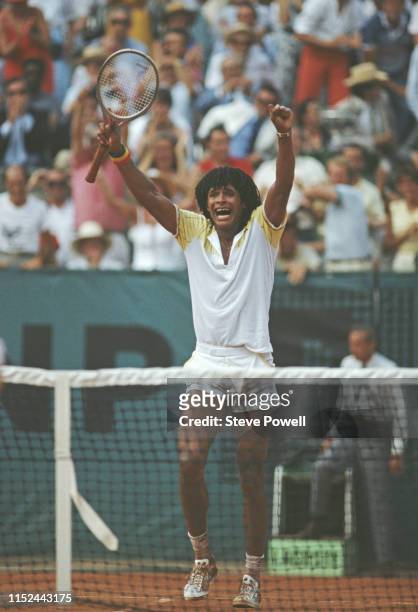 Yannick Noah of France raises his arms in celebration after defeating Mats Wilander in the Men's Singles final match during the French Open Tennis...