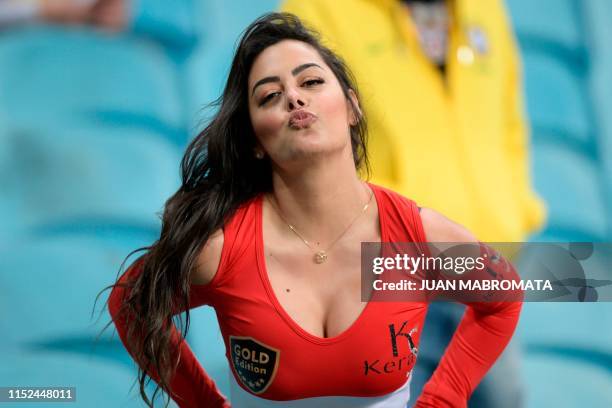 Paraguay's model Larissa Riquelme poses for pictures before the Copa America football tournament quarter-final match between Paraguay and Brazil at...