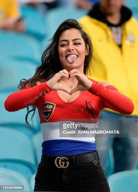 Paraguay's model Larissa Riquelme poses for pictures before the Copa America football tournament quarter-final match between Paraguay and Brazil at...