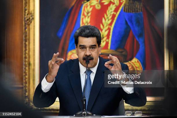 Nicolas Maduro President of Venezuela gestures as he speaks during the Simon Bolivar Journalism National Award ceremony at Palacio de Miraflores on...