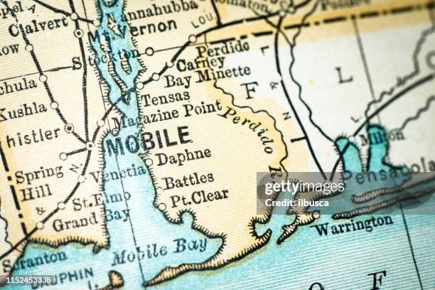 antique usa map close-up detail: mobile, alabama - alabama stock illustrations