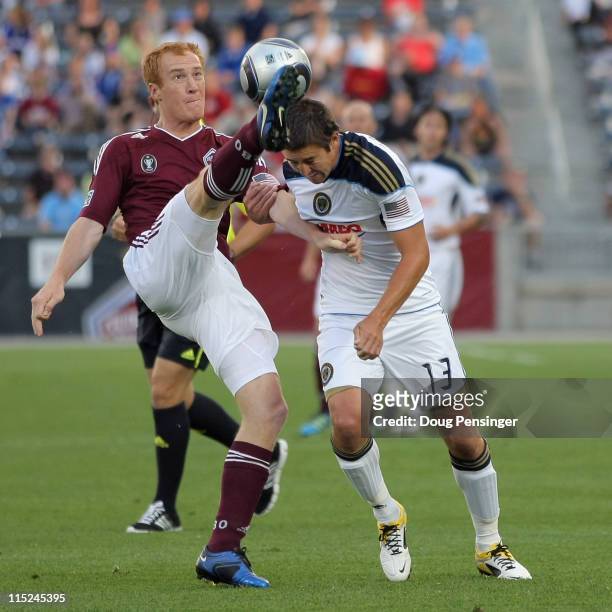 Jeff Larentowicz of the Colorado Rapids and Kyle Nakazawa of the Philadelphia Union battle for control of the ball at Dick's Sporting Goods Park on...