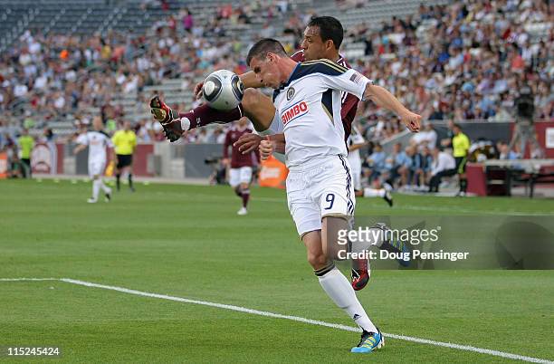 Tyrone Marshall of the Colorado Rapids clears the ball away from Sebastien Le Toux of the Philadelphia Union at Dick's Sporting Goods Park on June 4,...