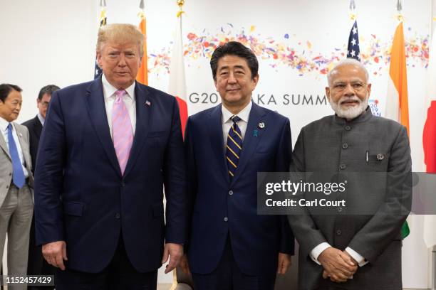 President Donald Trump, Japan's Prime Minister, Shinzo Abe and India's Prime Minister, Narendra Modi, take part in a trilateral meeting on the first...