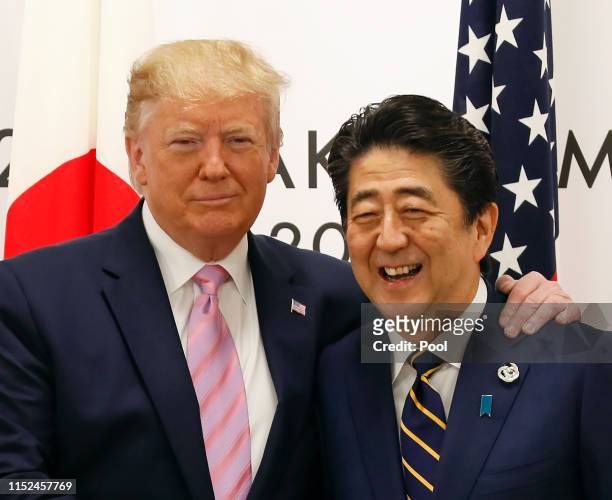 President Donald J. Trump with Japanese Prime Minister Shinzo Abe at the start of talks at the venue of the G20 Summit on June 28, 2019 in Osaka,...
