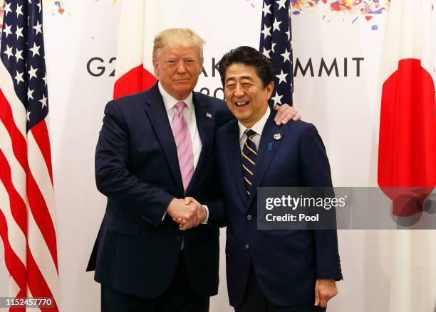 President Donald J. Trump with Japanese Prime Minister Shinzo Abe at the start of talks at the venue of the G20 Summit on June 28, 2019 in Osaka,...