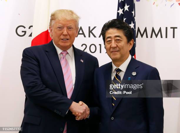 President Donald J. Trump with Japanese Prime Minister Shinzo Abe at the start of talks at the venue of the G20 Summit on June 28, 2019 in Osaka,...
