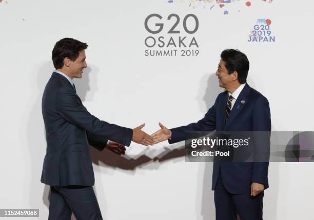 Canadian Prime Minister Justin Trudeau welcomed by Japanese Prime Minister Shinzo Abe for a family photo session on the first day of the G20 summit...