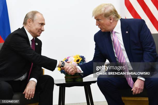 President Donald Trump attends a meeting with Russia's President Vladimir Putin during the G20 summit in Osaka on June 28, 2019.