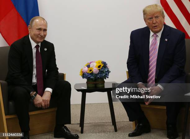 President Donald Trump and Russian President Vladimir Putin attend their bilateral meeting at the G20 Osaka Summit 2019, in Osaka, Japan, June 2019....