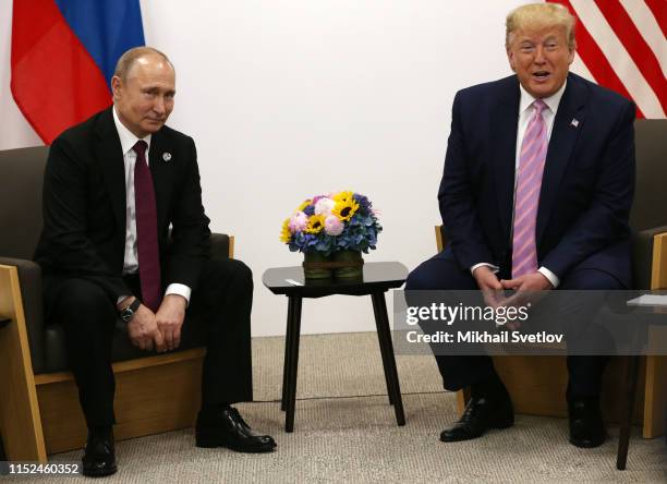 President Donald Trump and Russian President Vladimir Putin attend their bilateral meeting at the G20 Osaka Summit 2019, in Osaka, Japan, June 2019....