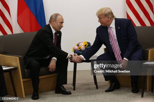 President Donald Trump and Russian President Vladimir Putin attend their bilateral meeting at the G20 Osaka Summit 2019, in Osaka, Japan, June 2019....