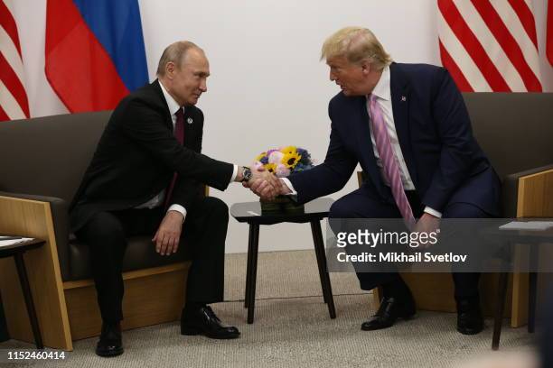 President Donald Trump and Russian President Vladimir Putin attend their bilateral meeting at the G20 Osaka Summit 2019, in Osaka, Japan, June 2019....
