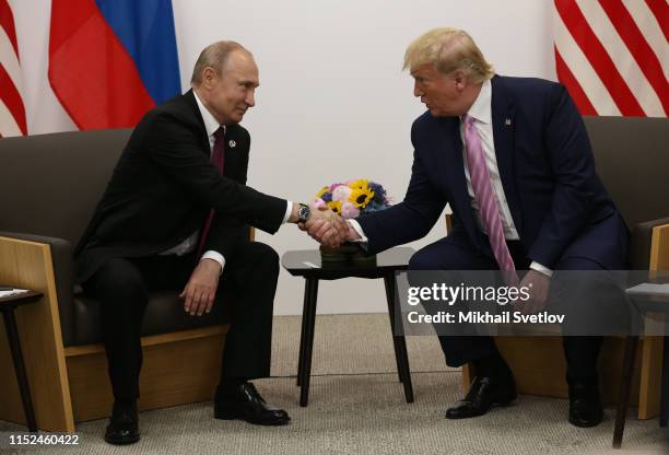 President Donald Trump and Russian President Vladimir Putin attend their bilateral meeting at the G20 Osaka Summit 2019, in Osaka, Japan, June 2019....