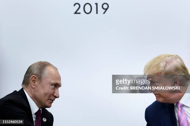 President Donald Trump attends a meeting with Russia's President Vladimir Putin during the G20 summit in Osaka on June 28, 2019.