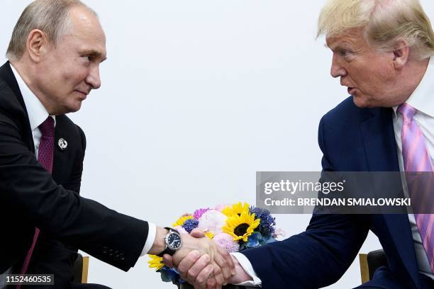 President Donald Trump attends a meeting with Russia's President Vladimir Putin during the G20 summit in Osaka on June 28, 2019.