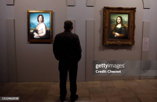 Visitor looks at different painted versions of the Mona Lisa by an artist from the workshop or circle of Leonardo Da Vinci displayed during a press...