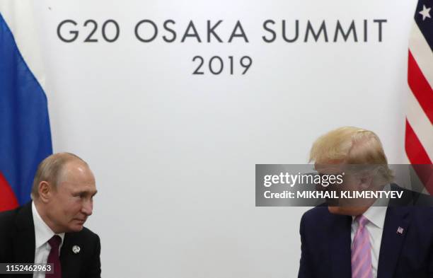 Russian President Vladimir Putin and US President Donald Trump hold a meeting on the sidelines of the G20 summit in Osaka on June 28, 2019.