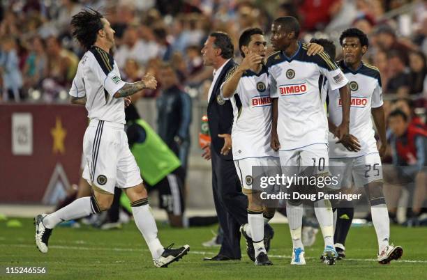 Danny Mwanga of the Philadelphia Union is congratulated by teammates Danny Califf, Gabriel Farfan and Sheanon Williams of the Union after he scored...