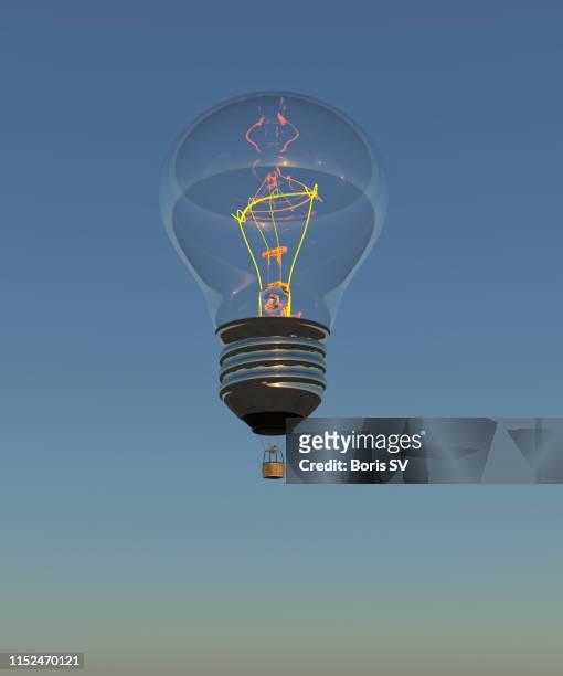 hot air balloon as incandescent light bulb - hot air balloon ride stock-fotos und bilder