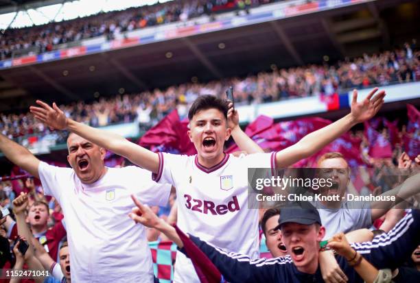 Aston Villa fans celebrate after winning the Sky Bet Championship Play-off Final match between Aston Villa and Derby County at Wembley Stadium on May...