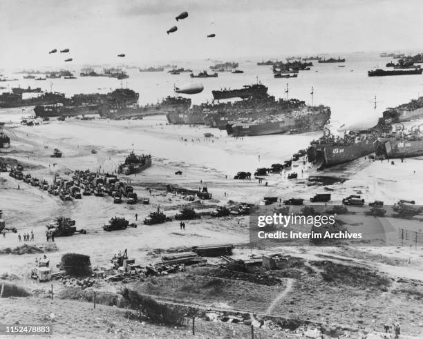 Aerial view of Allied craft, barrage balloons, and troops landing in Normandy, France during the invasion, June 6, 1944.