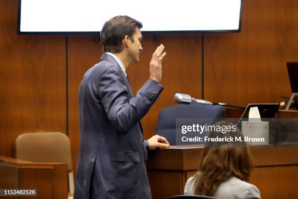 Ashton Kutcher is sworn in before testifying during the trial of alleged serial killer Michael Gargiulo, known as the “Hollywood Ripper,” at the...