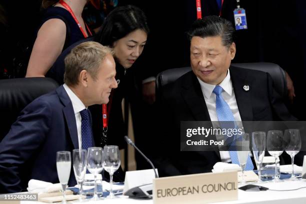 Xi Jinping, China's president, right, talks with Donald Tusk, president of the European Union , left, prior to a working lunch on the first day of...