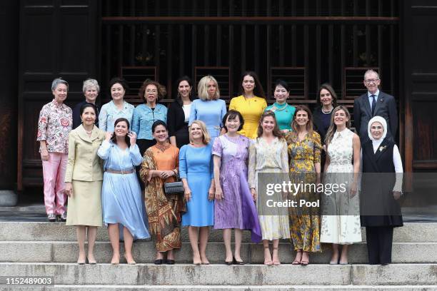 Partners of the G20 leaders pose for a family photo at G20 partners program in Tofuku-ji Temple on the first day of the G20 summit on June 28, 2019...