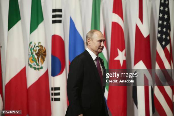 Russian President Vladimir Putin is welcomed by Japanese Prime Minister Shinzo Abe on the first day of the G20 summit in Osaka, Japan on June 28,...