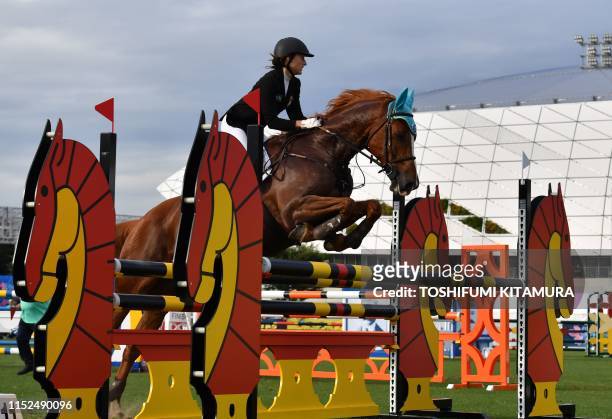 France's Marie Oteiza jumps during women's individual equestrian event during the UIPM World Cup modern pentathlon test event for the Tokyo 2020...