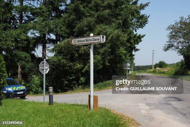 This picture taken on June 28, 2019 shows a sign indicating the entrance of the Notre Dame Abbey of Fontgombault, central France, where French...