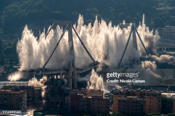 Explosive charges blow up the eastern pylons of collapsed Morandi bridge. The Morandi viaduct collapsed on August 14, 2018 causing the death of 43...