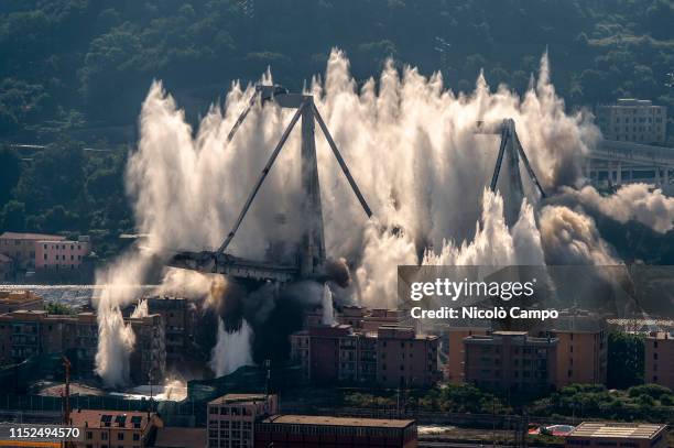 Explosive charges blow up the eastern pylons of collapsed Morandi bridge. The Morandi viaduct collapsed on August 14, 2018 causing the death of 43...