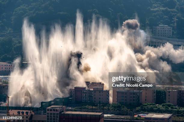 Explosive charges blow up the eastern pylons of collapsed Morandi bridge. The Morandi viaduct collapsed on August 14, 2018 causing the death of 43...