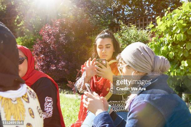 Young women using smartphones