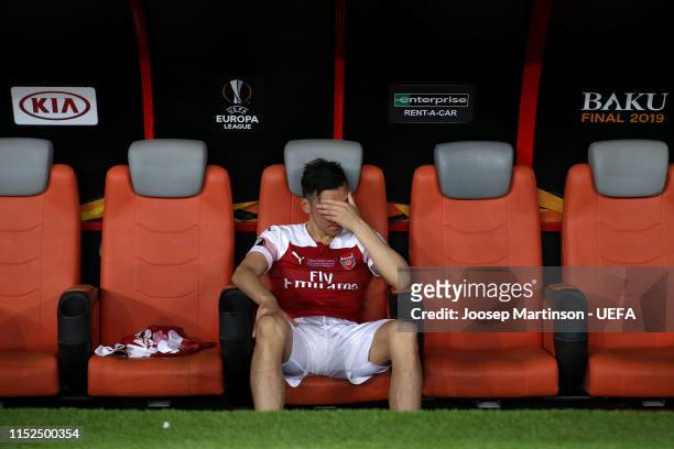 Mesut Ozil of Arsenal looks dejected from the bench following his team's defeat in the UEFA Europa League Final between Chelsea and Arsenal at Baku...