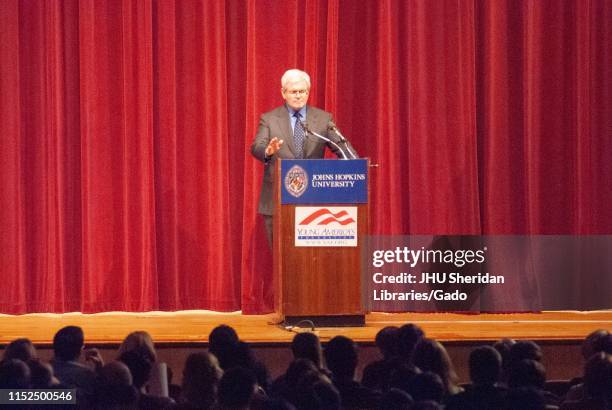 Politician Newt Gingrich, speaking from a podium on a stage during a Milton S Eisenhower Symposium, Homewood Campus of Johns Hopkins University,...