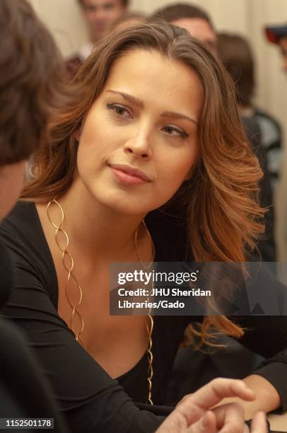 Close-up of supermodel and philanthropist Petra Nemcova, speaking with an attendee during a Milton S Eisenhower Symposium, Homewood Campus of Johns...