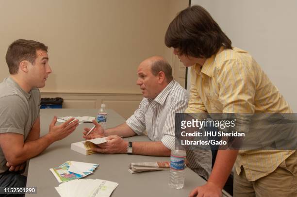 David Simon, a television producer and creator of HBO television show The Wire, speaks with attendees at the Johns Hopkins University, Baltimore,...