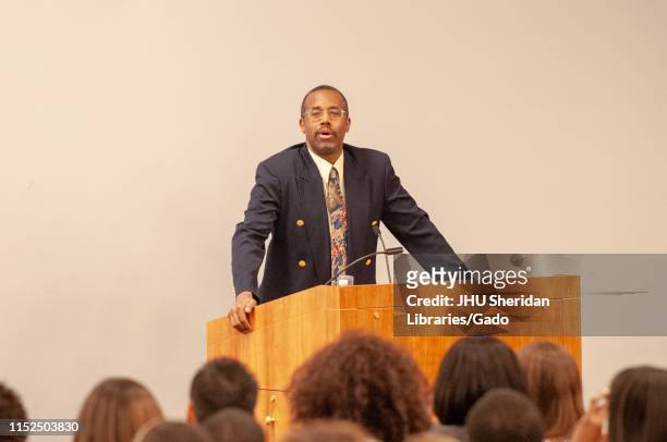 Neurosurgeon and politician Ben Carson, from the waist up, speaking from a podium during the Minority Pre-Health Conference at the Johns Hopkins...